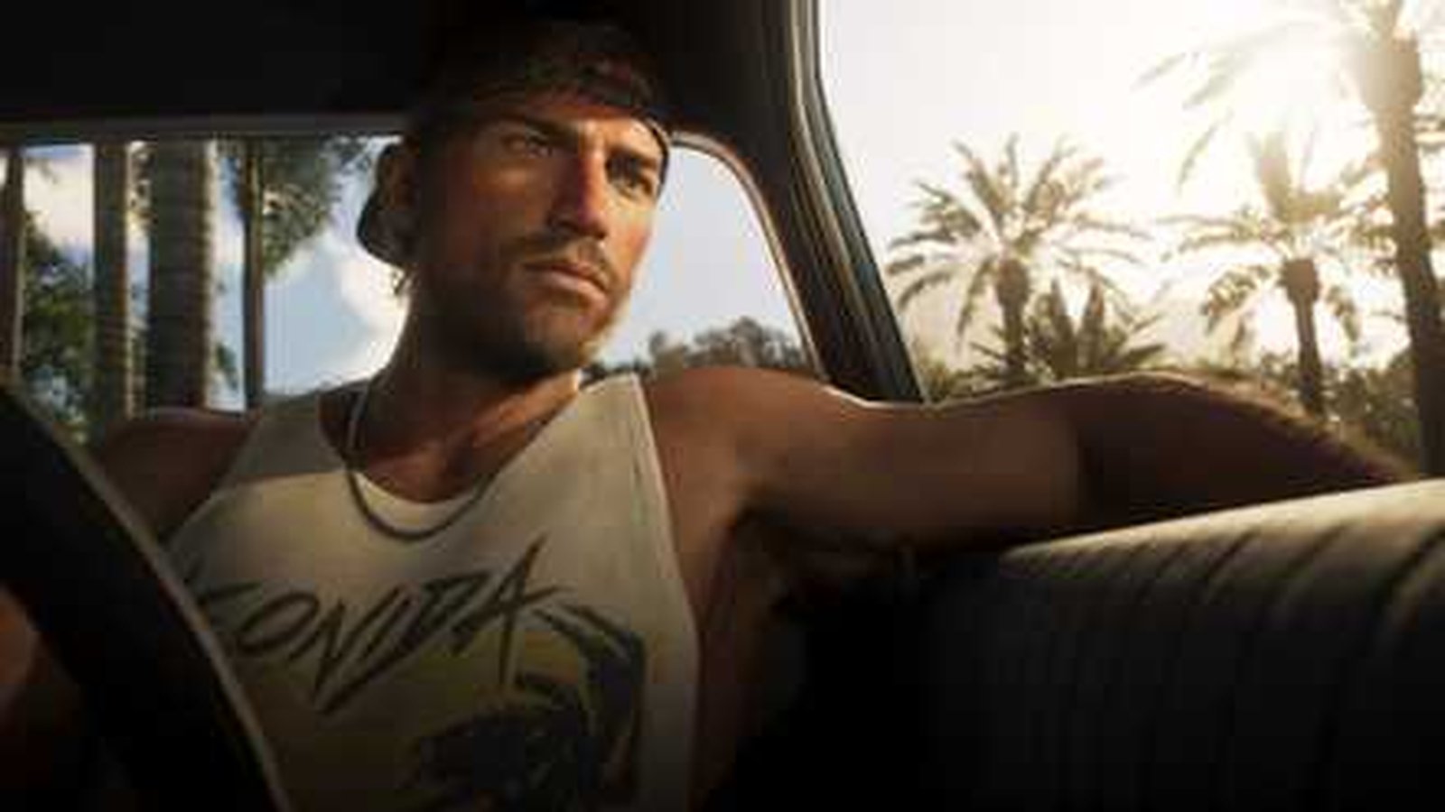 GTA 6 personnage masculin dans voiture avec palmiers, screenshot console