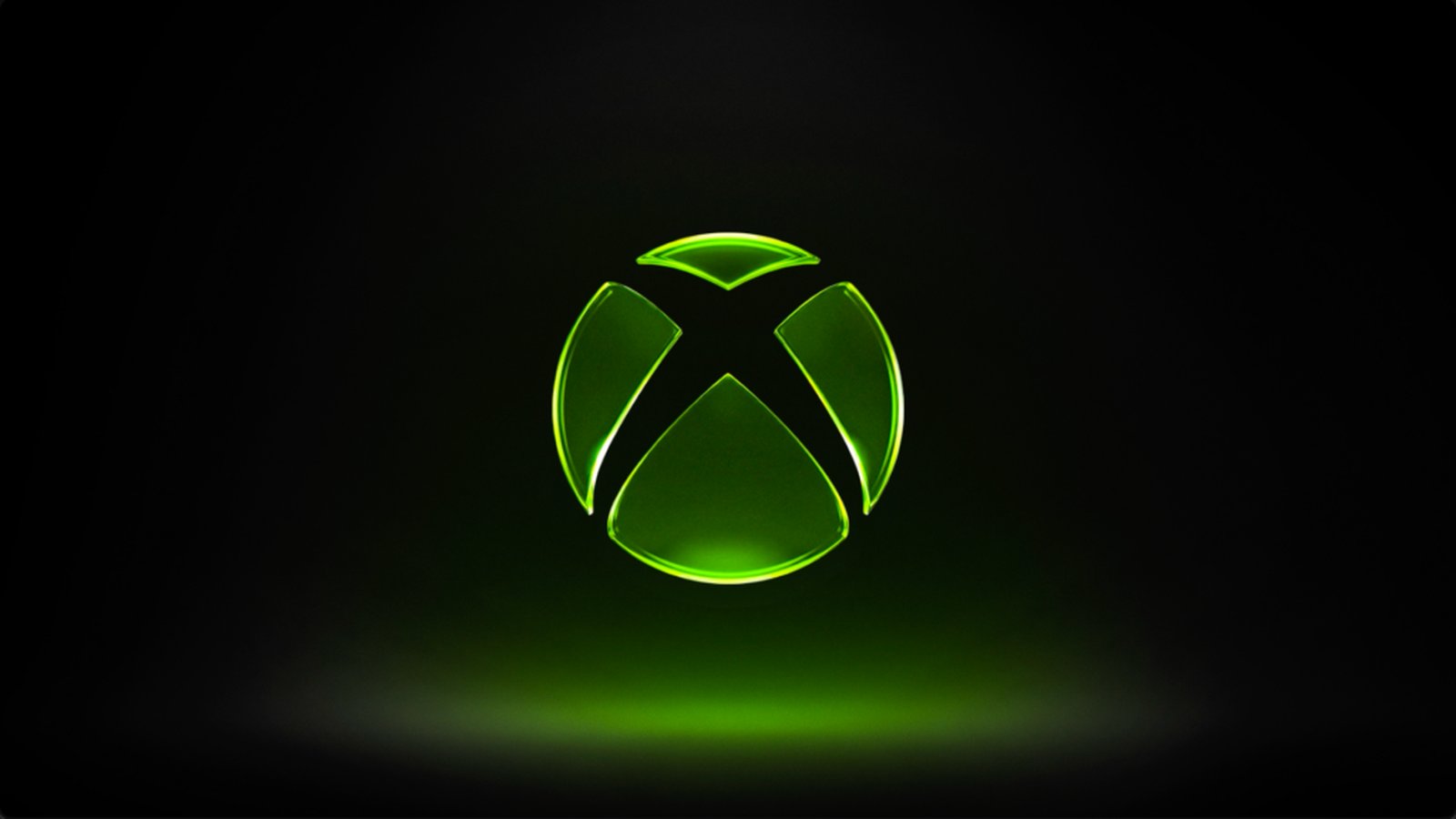 Logo Xbox lumineux vert sur fond noir, identité visuelle Microsoft