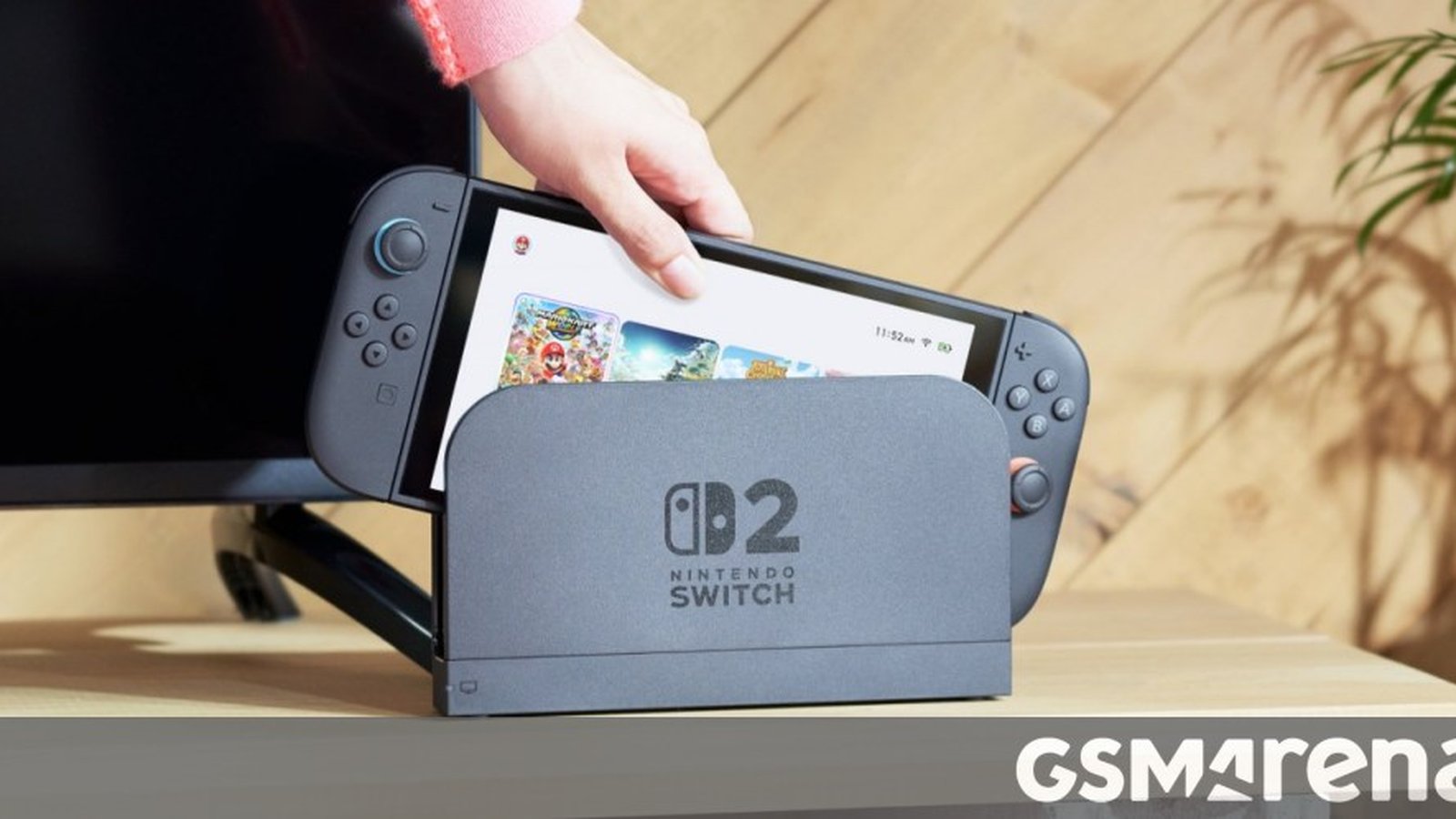 Nintendo Switch 2 posée dans son dock gris avec logo officiel
