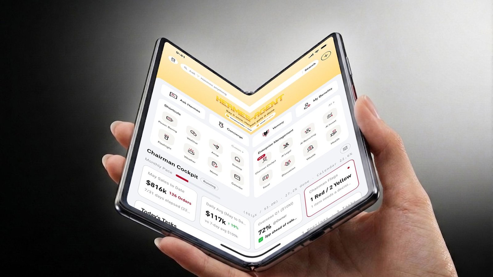 Vertu AlphaFold pliable avec agent IA Hermes affiché, tenu en main