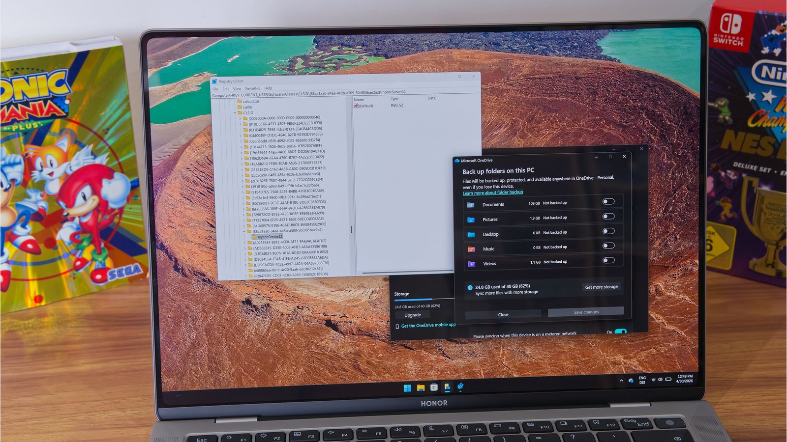 Windows 11 avec éditeur de registre Win32 ouvert sur laptop Honor
